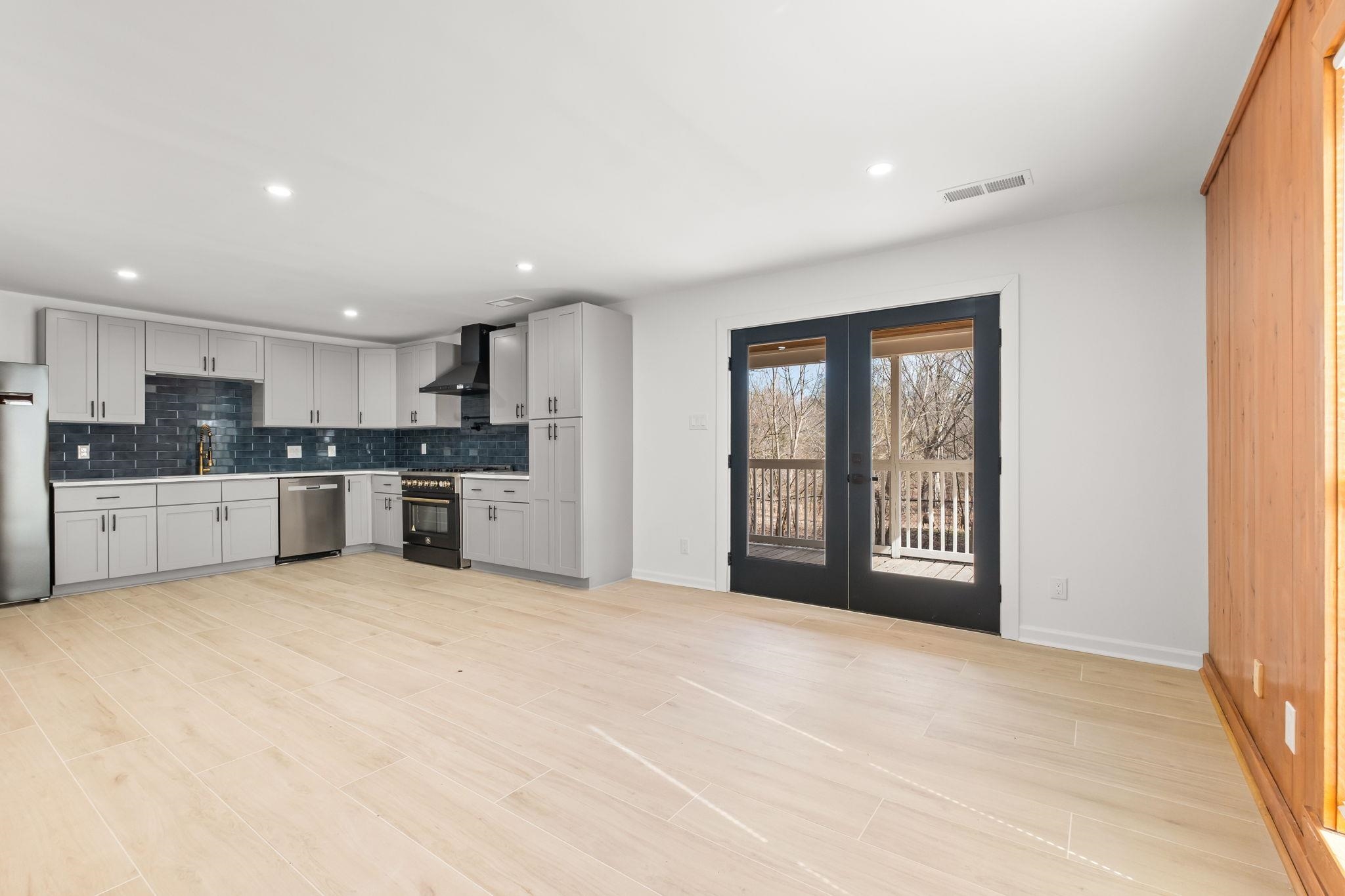 6224 Benjestown Road Memphis, TN 38127 - Photo 9 of 38 Kitchen with french doors, tasteful backsplash, light countertops, stainless steel appliances, and recessed lighting