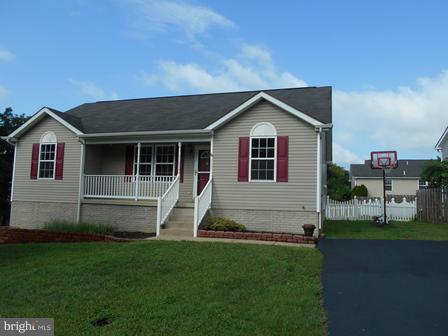 117 Michelle Drive Ranson, WV 25438 - Photo 2 of 24 a house view with a garden space