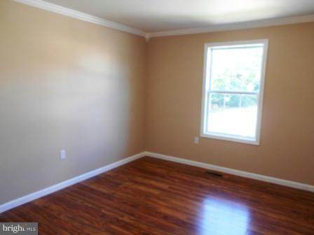 117 Michelle Drive Ranson, WV 25438 - Photo 12 of 24 a view of an empty room with wooden floor and a window