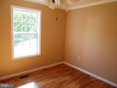 117 Michelle Drive Ranson, WV 25438 - Photo 13 of 24 a view of an empty room with wooden floor and a window
