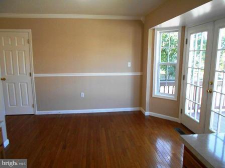 117 Michelle Drive Ranson, WV 25438 - Photo 10 of 24 an empty room with wooden floor and windows