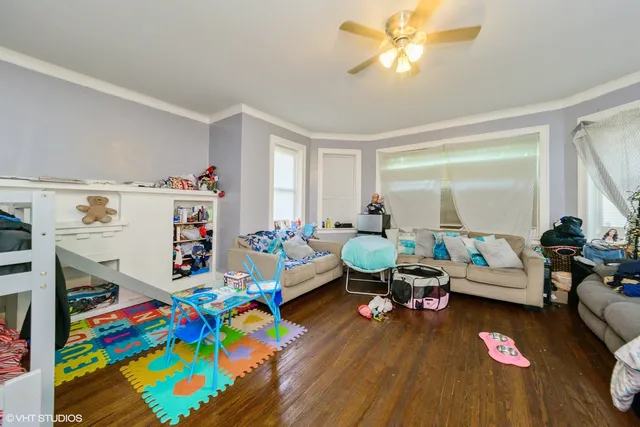 a playing room with toys and a couch