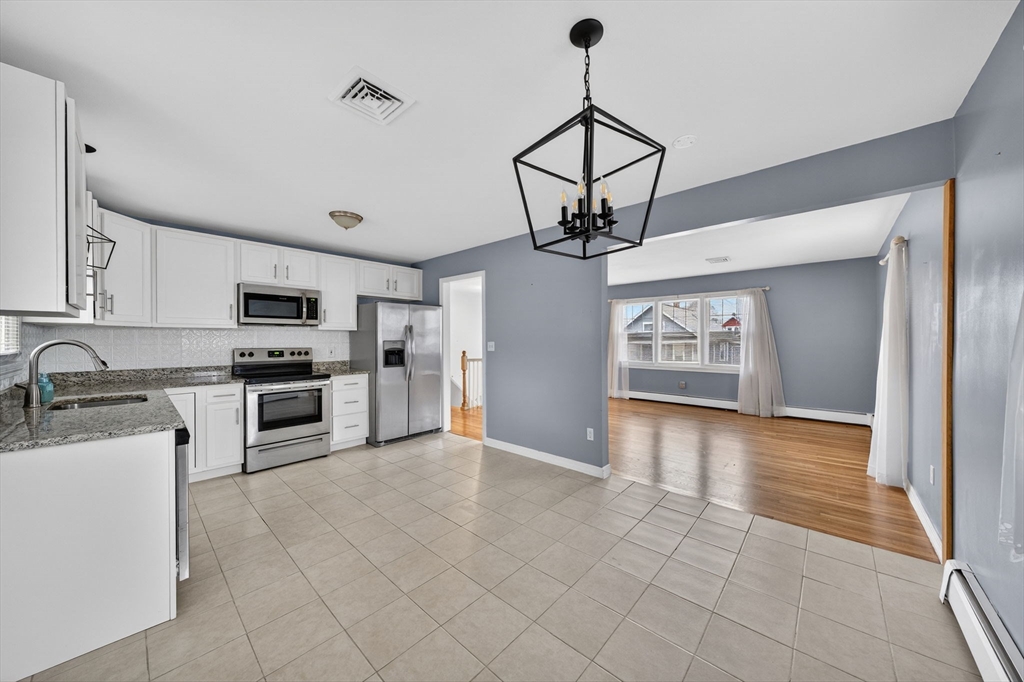25 Morton Street Fairhaven, MA 02719 - Photo 15 of 34 a view of a kitchen with sink and stainless steel appliances