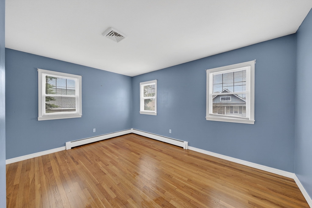 25 Morton Street Fairhaven, MA 02719 - Photo 20 of 34 a view of an empty room with wooden floor and a window
