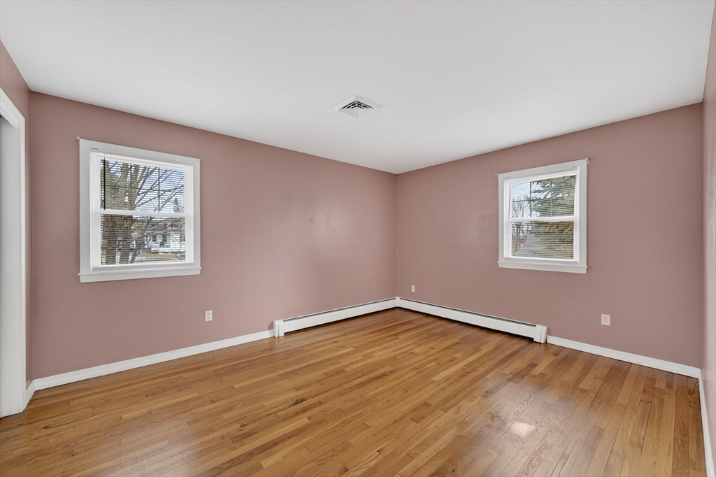 25 Morton Street Fairhaven, MA 02719 - Photo 22 of 34 a view of an empty room with wooden floor and a window