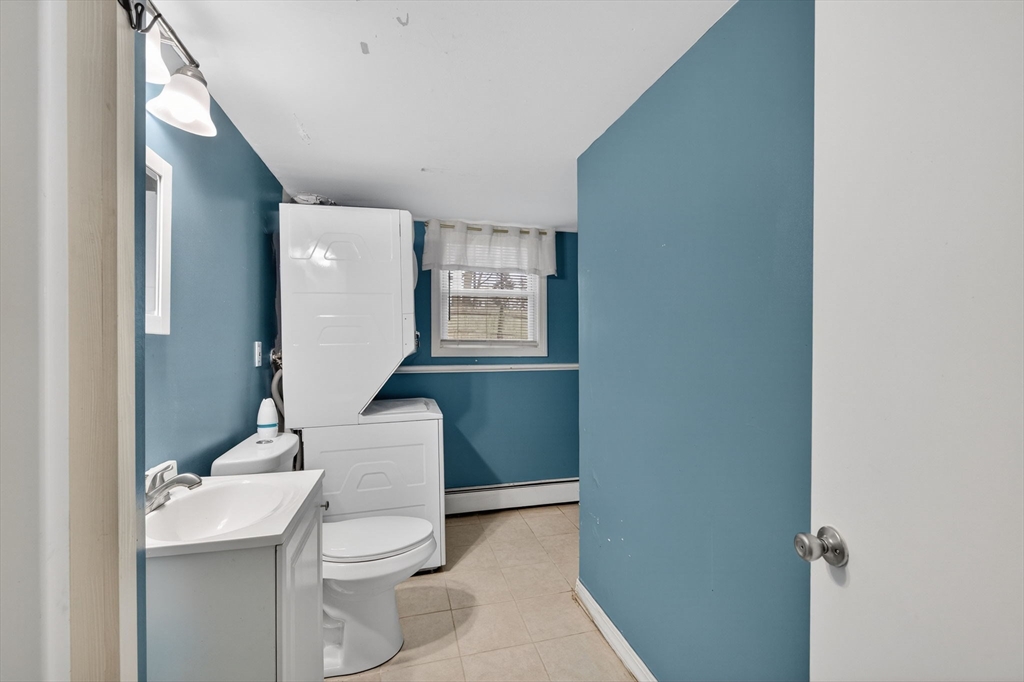 25 Morton Street Fairhaven, MA 02719 - Photo 27 of 34 a bathroom with a toilet a sink and mirror