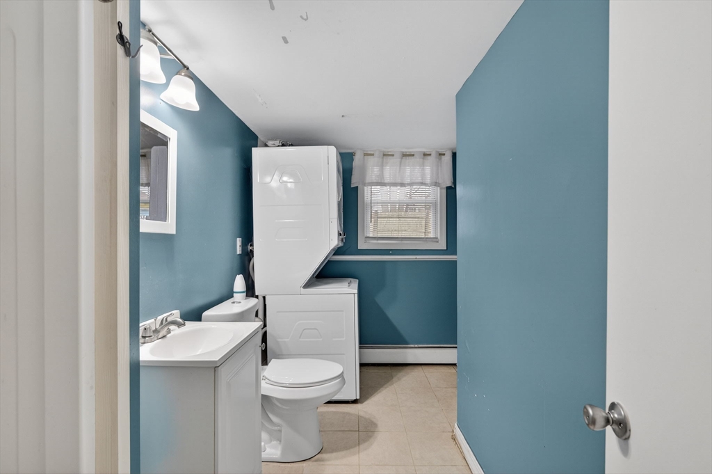 25 Morton Street Fairhaven, MA 02719 - Photo 28 of 34 a bathroom with a toilet sink and mirror
