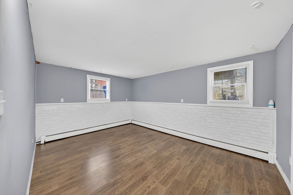 25 Morton Street Fairhaven, MA 02719 - Photo 32 of 34 an empty room with wooden floor and windows