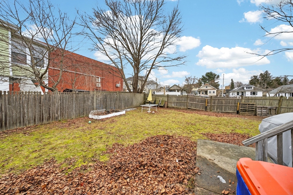 25 Morton Street Fairhaven, MA 02719 - Photo 4 of 34 a view of backyard with wooden fence
