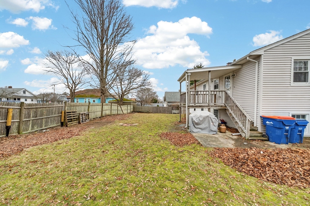 25 Morton Street Fairhaven, MA 02719 - Photo 5 of 34 a view of backyard with wooden fence