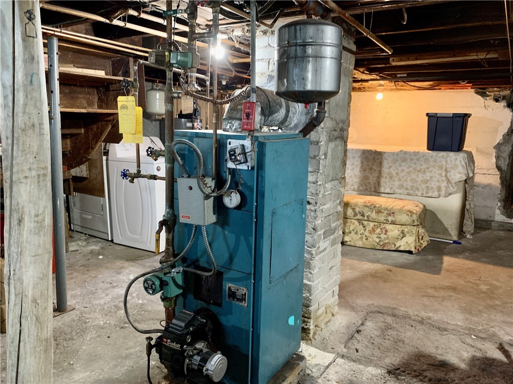44 Mason Street Warren, RI 02885 - Photo 29 of 33 First floor oil heating system, storage area with laundry hook ups