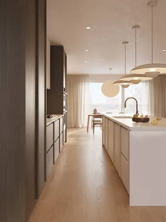 a kitchen with kitchen island stainless steel appliances a sink and cabinets