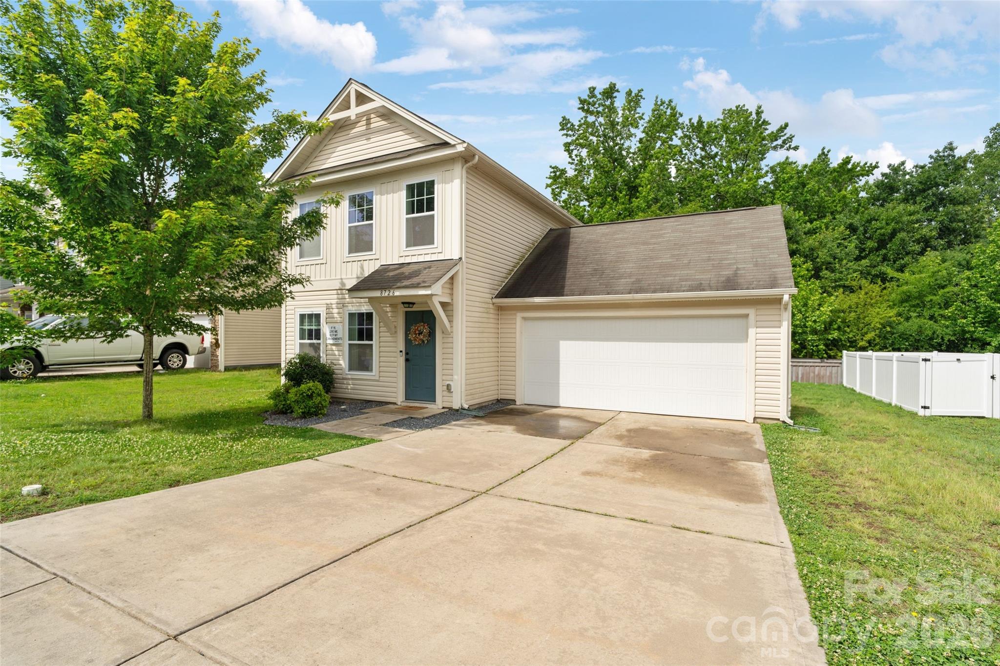 8726 Conrad Street Locust, NC 28097 - Photo 25 of 36 a front view of a house with a yard and garage