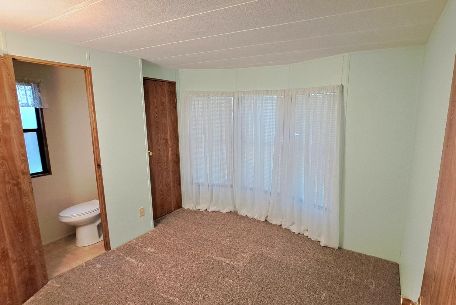 5766 Pony Express Trail, Unit 4 Pollock Pines, CA 95726 - Photo 14 of 17 a bathroom with a sink and a toilet