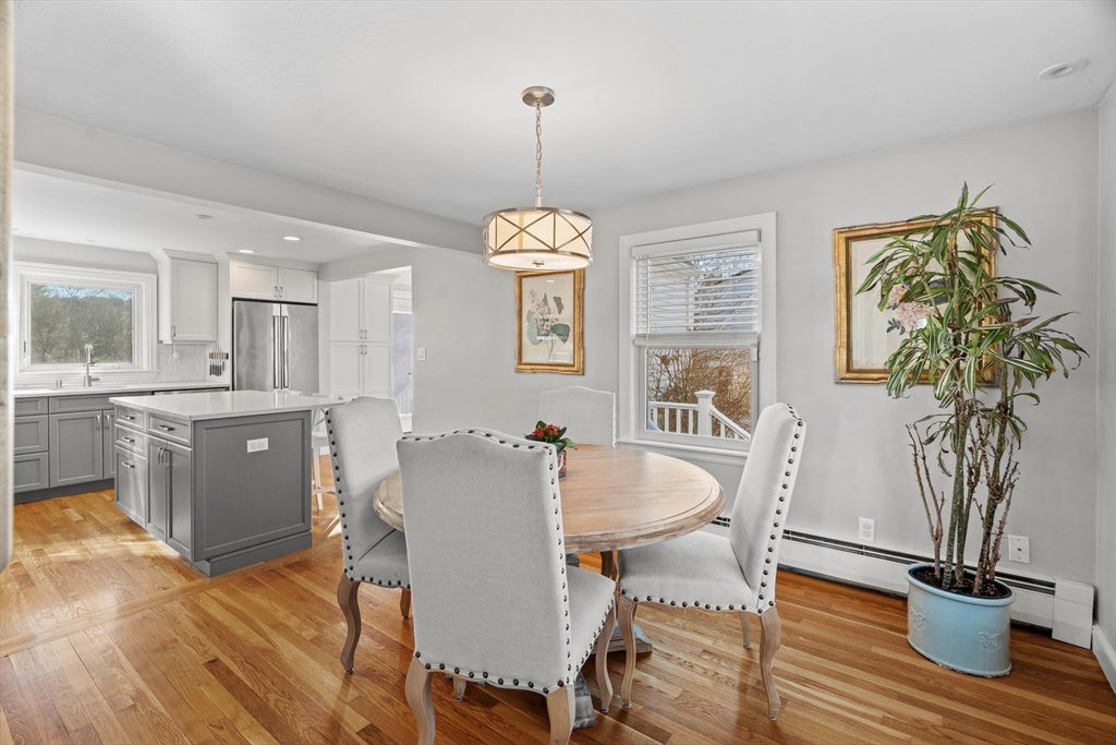 21 Oakvale Road Framingham, MA 01701 - Photo 12 of 42 a view of a dining room with furniture window and wooden floor