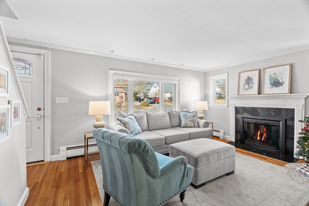 21 Oakvale Road Framingham, MA 01701 - Photo 14 of 42 a living room with furniture and a fireplace