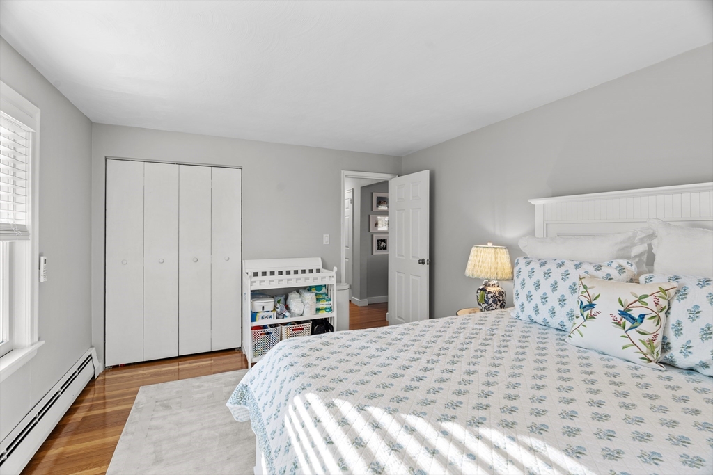 21 Oakvale Road Framingham, MA 01701 - Photo 21 of 42 a bedroom with a bed and a cabinets