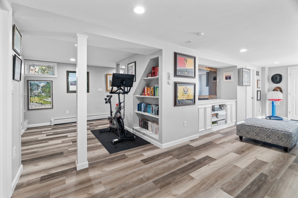 21 Oakvale Road Framingham, MA 01701 - Photo 23 of 42 a living room with furniture and paintings on the wall