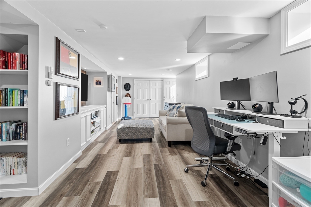 21 Oakvale Road Framingham, MA 01701 - Photo 24 of 42 a living room with furniture a rug and a flat screen tv