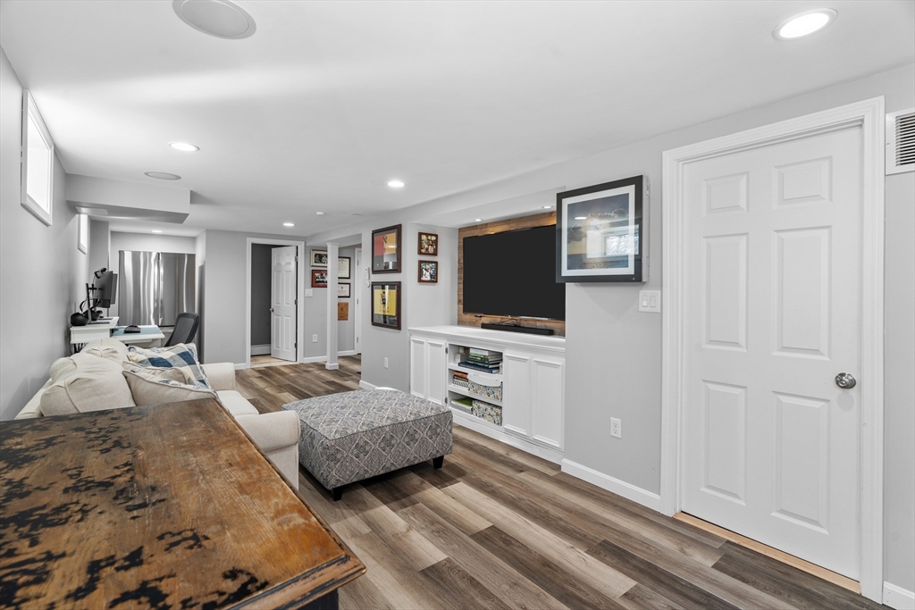 21 Oakvale Road Framingham, MA 01701 - Photo 25 of 42 a living room with furniture and a flat screen tv