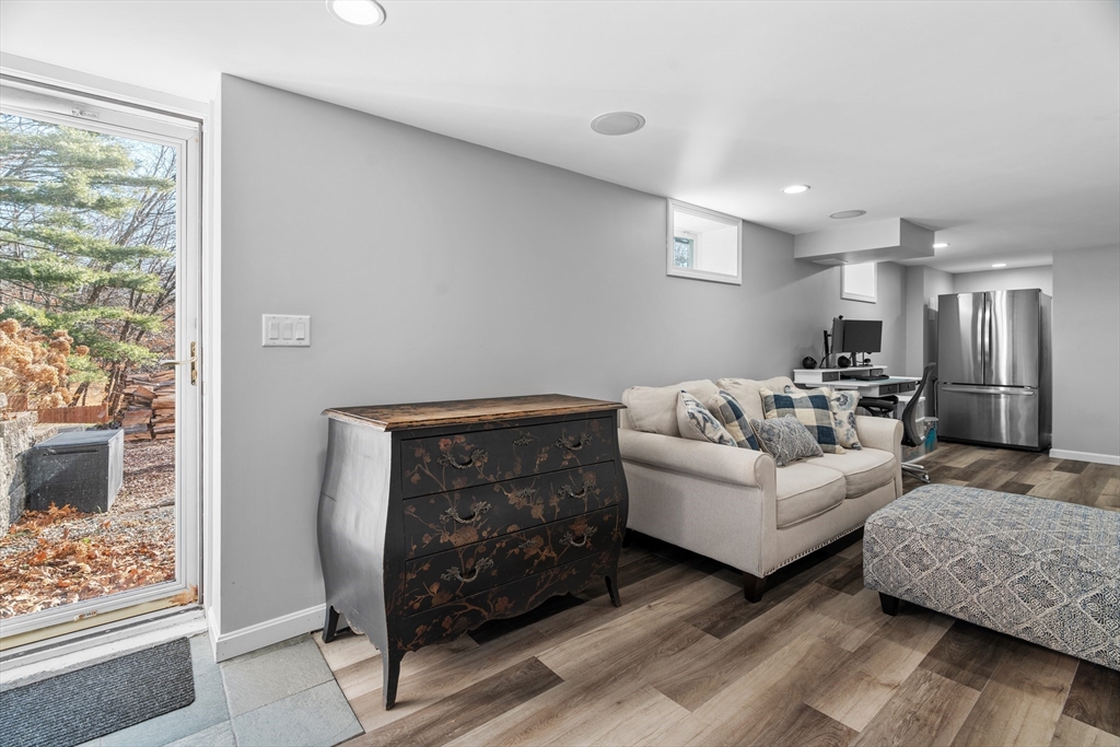 21 Oakvale Road Framingham, MA 01701 - Photo 26 of 42 a living room with furniture and a fireplace