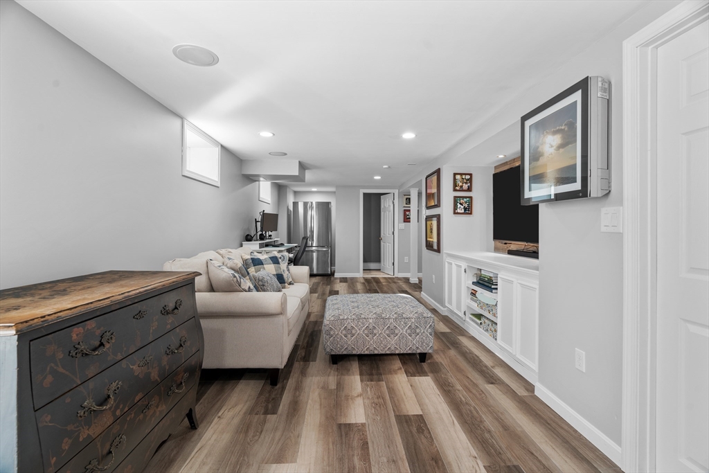 21 Oakvale Road Framingham, MA 01701 - Photo 27 of 42 a living room with furniture and a flat screen tv