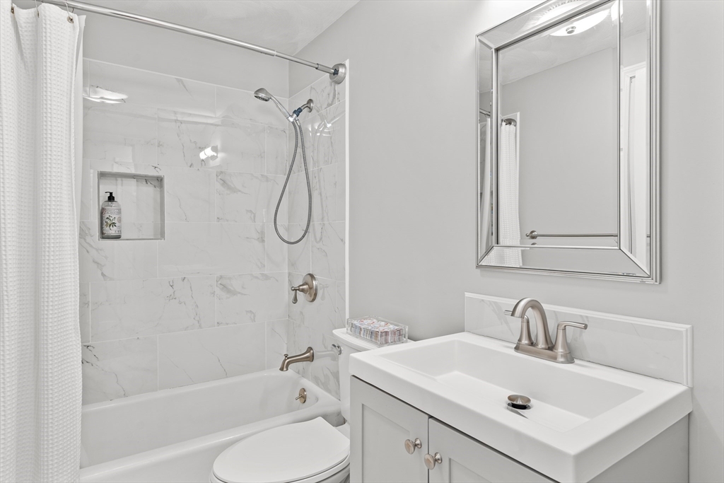 21 Oakvale Road Framingham, MA 01701 - Photo 29 of 42 a bathroom with a sink toilet tub and shower