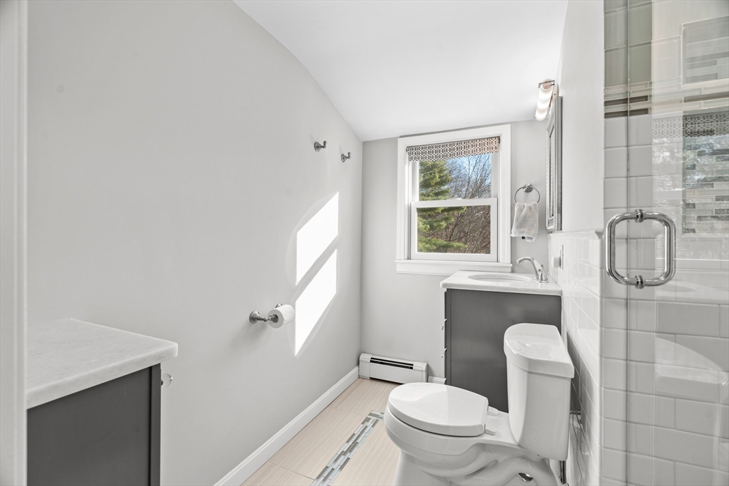 21 Oakvale Road Framingham, MA 01701 - Photo 31 of 42 a bathroom with a toilet sink and mirror