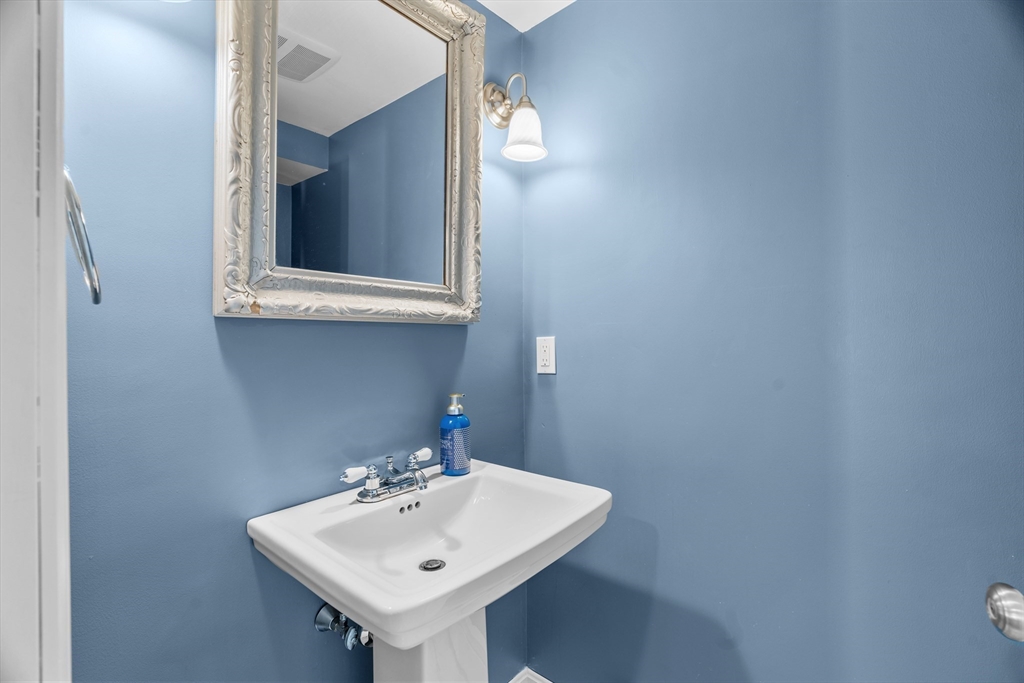 21 Oakvale Road Framingham, MA 01701 - Photo 32 of 42 a bathroom with a sink and a mirror