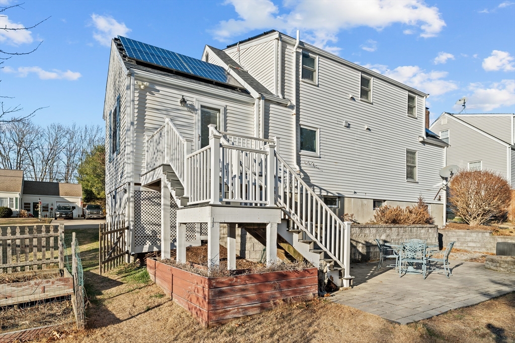 21 Oakvale Road Framingham, MA 01701 - Photo 33 of 42 a view of a house with wooden deck front of house