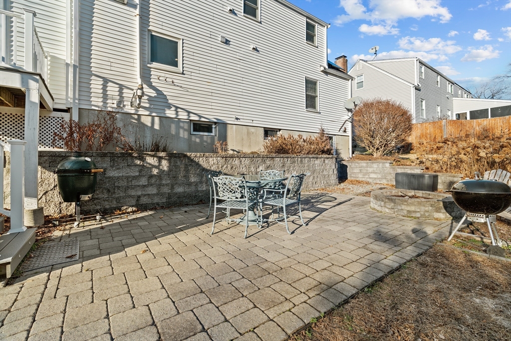 21 Oakvale Road Framingham, MA 01701 - Photo 35 of 42 a view of a patio with table and chairs and potted plants