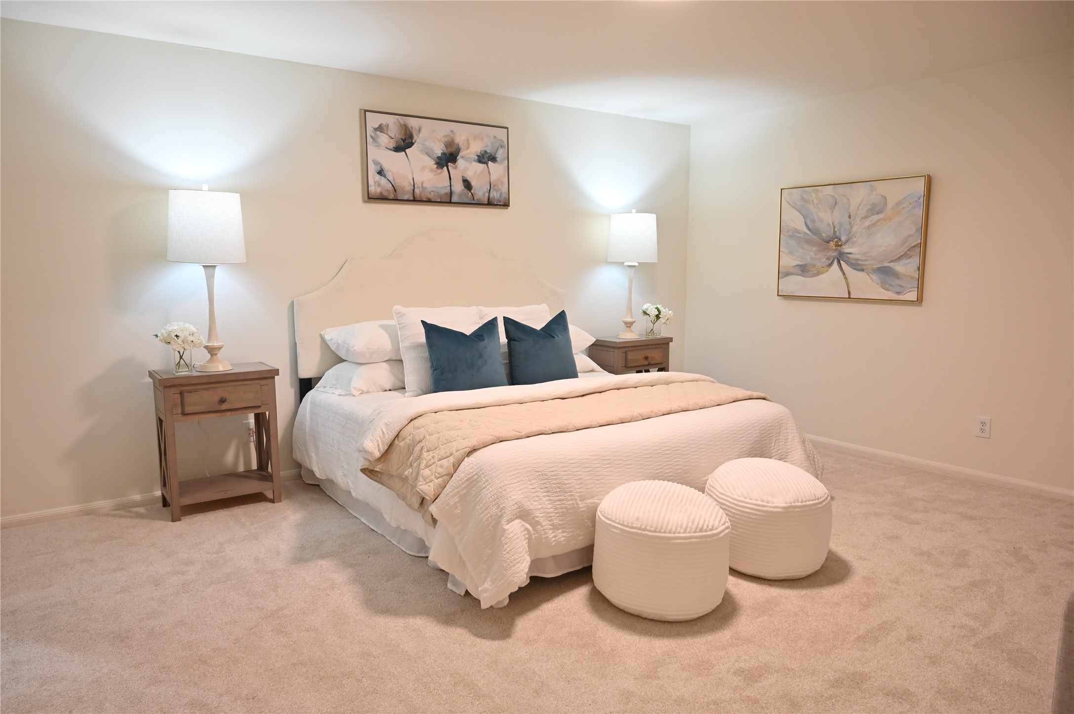 a bedroom with a bed and lamp