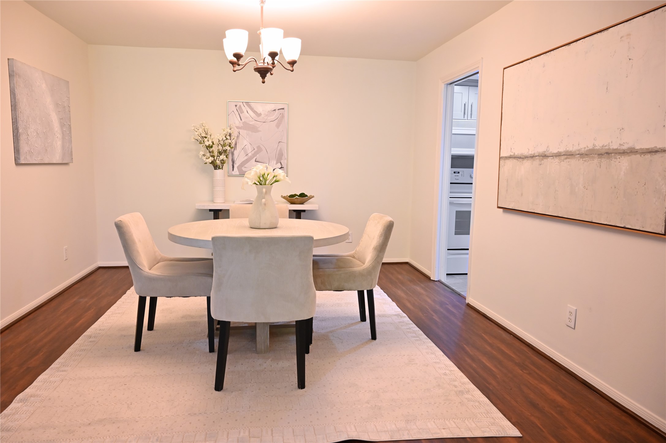 624 South Ripple Creek Drive, Unit 624 Houston, TX 77057 - Photo 6 of 30 a dining room with furniture a rug and wooden floor