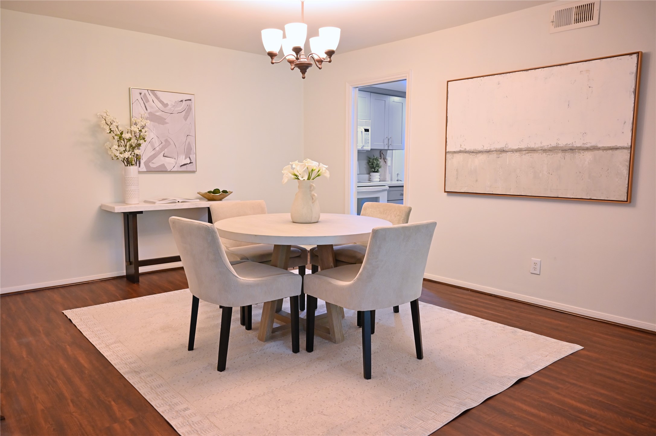 624 South Ripple Creek Drive, Unit 624 Houston, TX 77057 - Photo 7 of 30 a view of a dining room with furniture and wooden floor