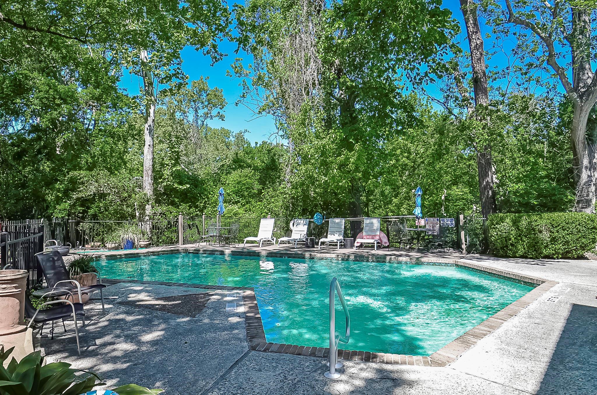 624 South Ripple Creek Drive, Unit 624 Houston, TX 77057 - Photo 10 of 30 a view of swimming pool with lawn chairs and plants