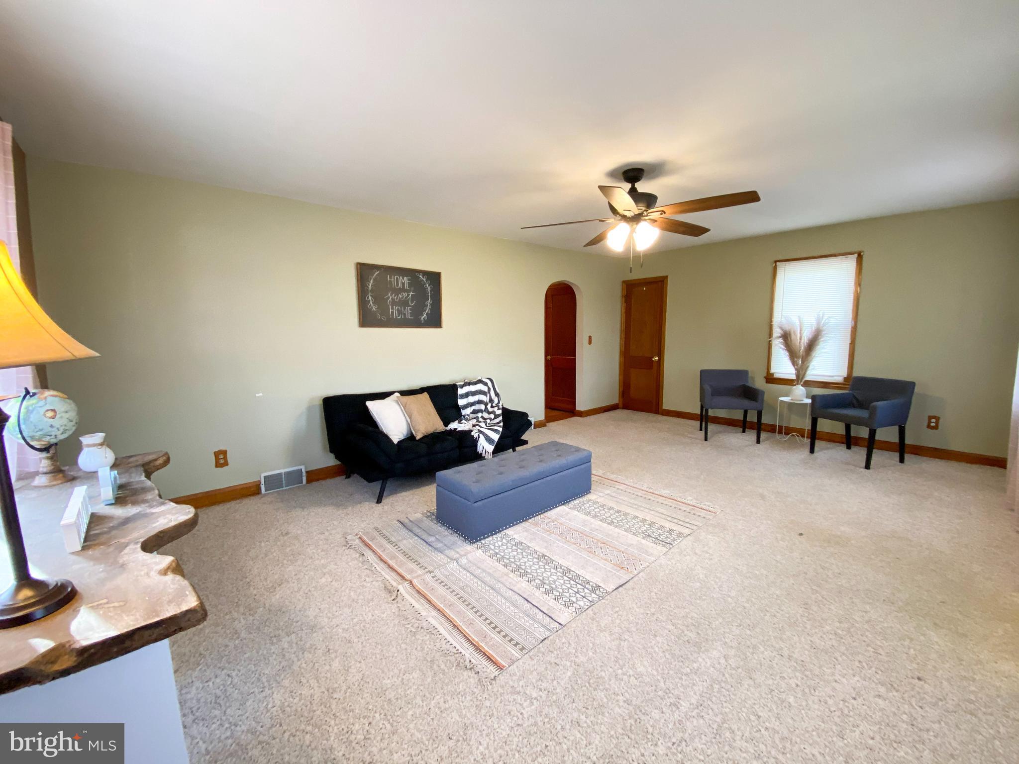 1026 Green Valley Road New Windsor, MD 21776 - Photo 14 of 57 a living room with furniture and a ceiling fan