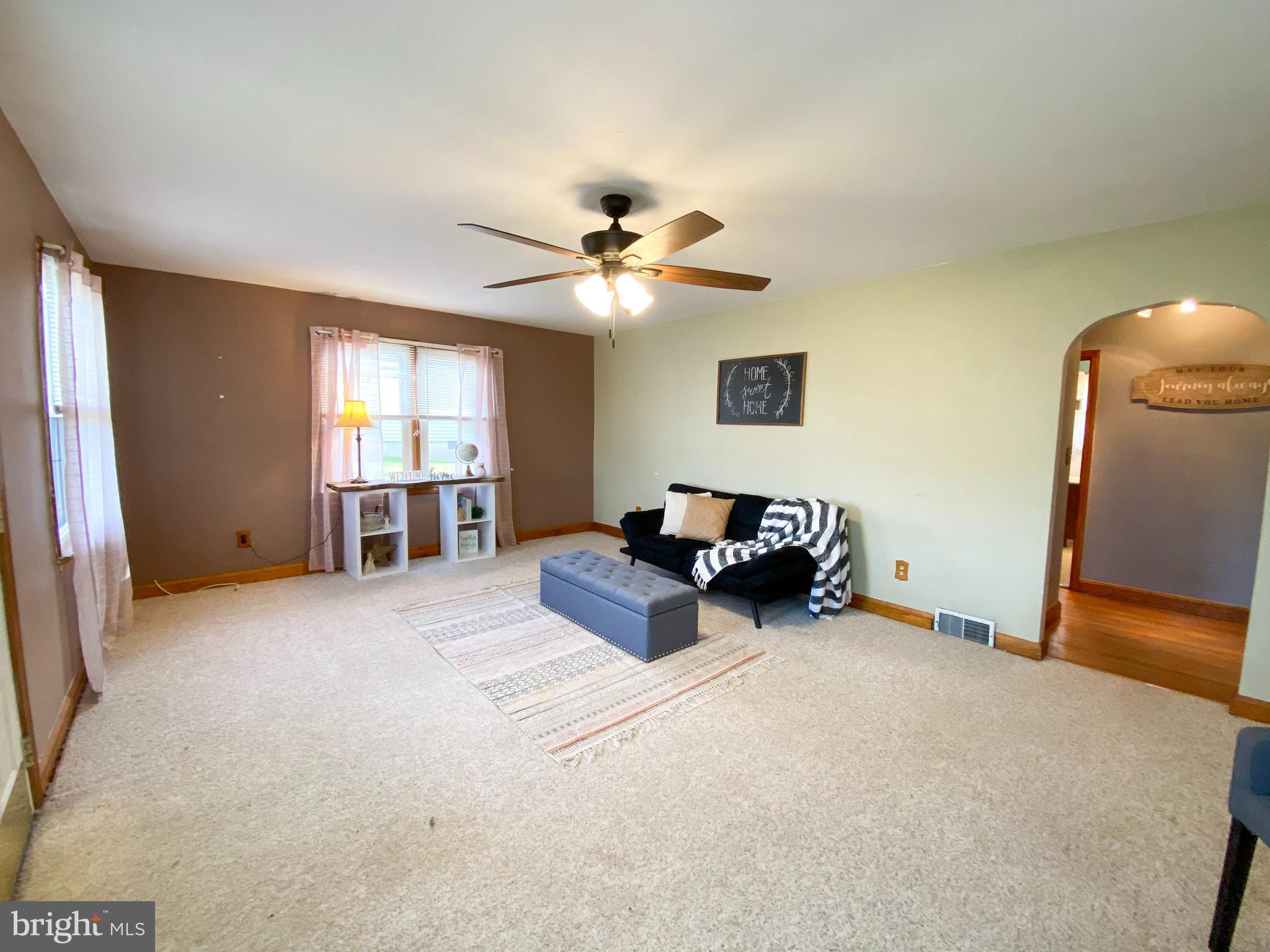 1026 Green Valley Road New Windsor, MD 21776 - Photo 16 of 57 a bed room with furniture and a ceiling fan