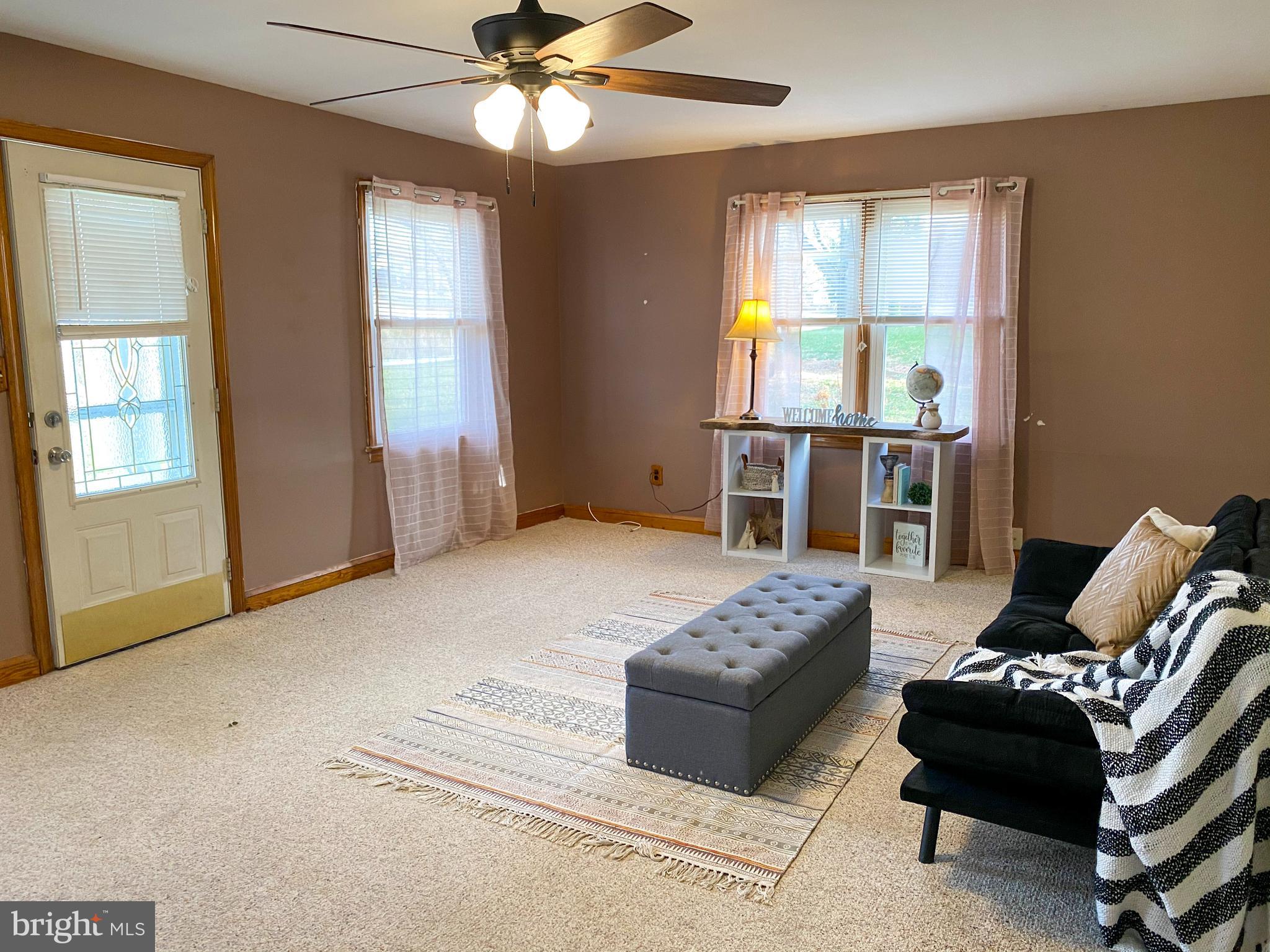 1026 Green Valley Road New Windsor, MD 21776 - Photo 17 of 57 a living room with furniture and a window