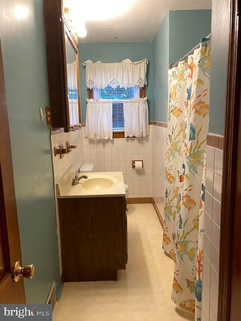 1026 Green Valley Road New Windsor, MD 21776 - Photo 30 of 57 a bathroom with a sink and a mirror