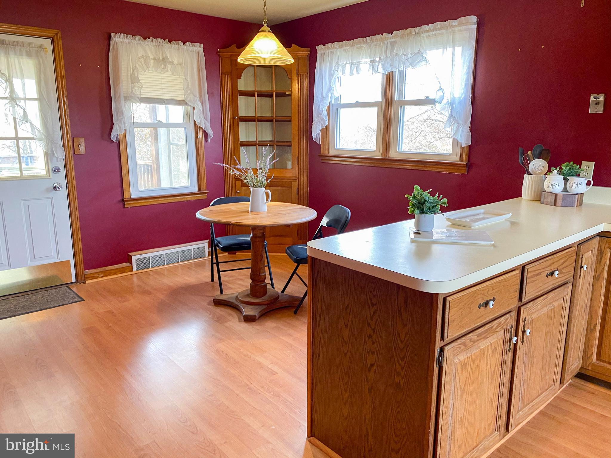 1026 Green Valley Road New Windsor, MD 21776 - Photo 39 of 57 a kitchen with a sink cabinets and wooden floor