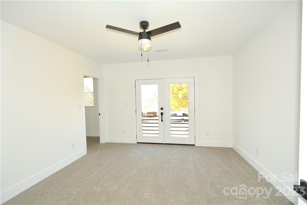 1511 Farm Road Shelby, NC 28152 - Photo 12 of 36 an empty room with windows and ceiling fan
