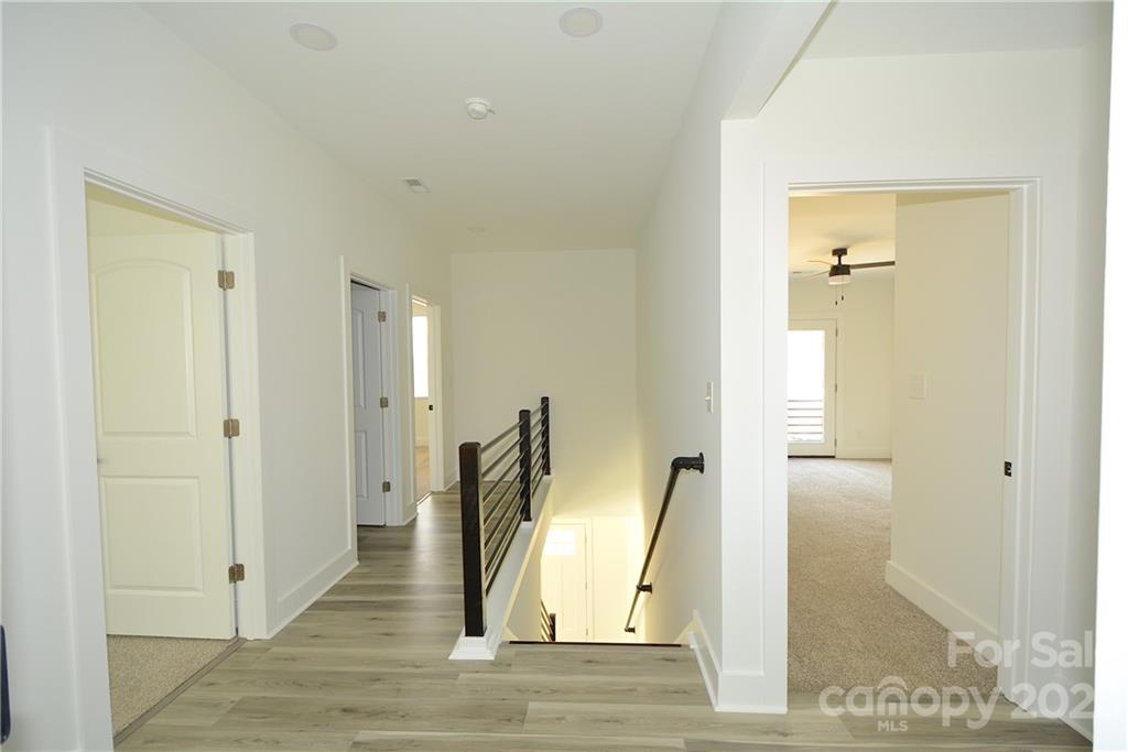 1511 Farm Road Shelby, NC 28152 - Photo 22 of 36 a view of a hallway with wooden floor and a bathroom