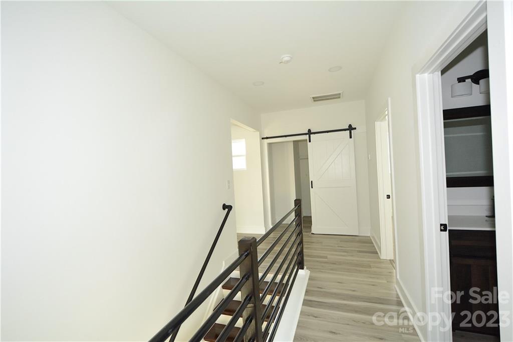 1511 Farm Road Shelby, NC 28152 - Photo 23 of 36 a view of a hallway with wooden floor and staircase