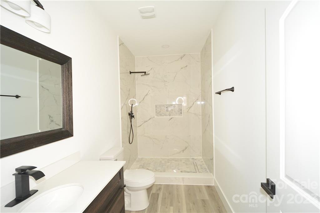 1511 Farm Road Shelby, NC 28152 - Photo 24 of 36 a bathroom with a sink toilet and shower