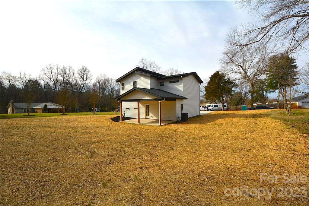 1511 Farm Road Shelby, NC 28152 - Photo 29 of 36 a house with a yard and a large tree
