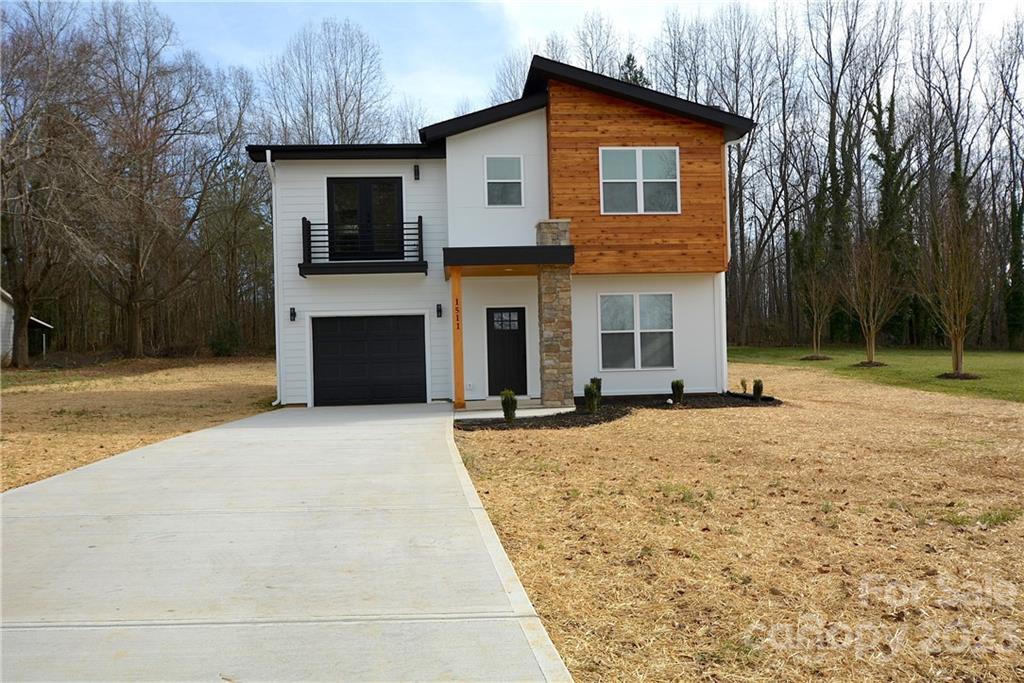 1511 Farm Road Shelby, NC 28152 - Photo 3 of 36 a front view of a house with a yard