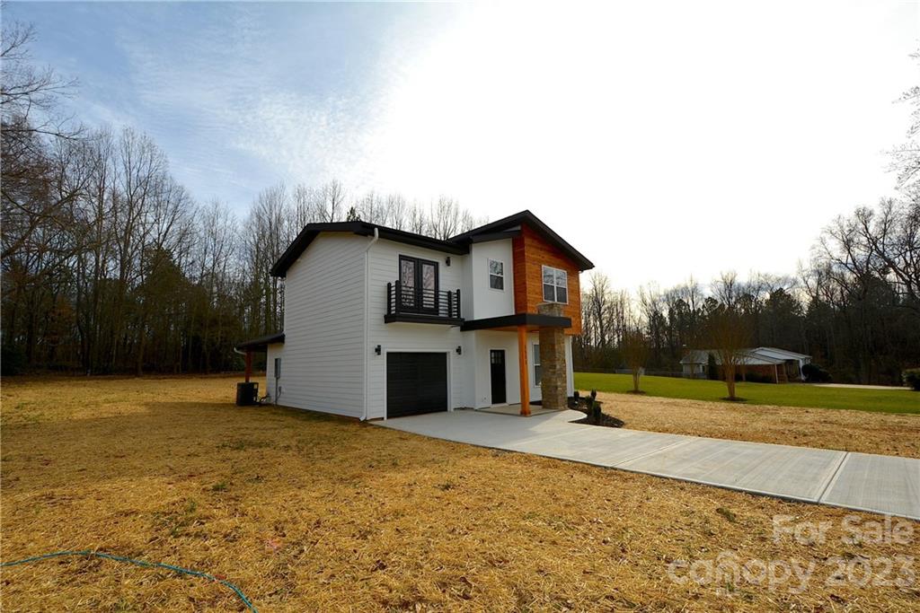 1511 Farm Road Shelby, NC 28152 - Photo 35 of 36 a view of a house with backyard and trees