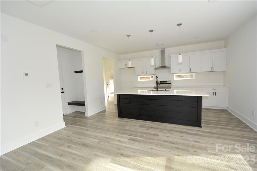 1511 Farm Road Shelby, NC 28152 - Photo 4 of 36 a kitchen with stainless steel appliances kitchen island sink refrigerator and cabinets