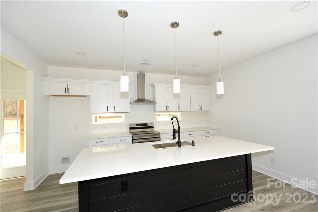 1511 Farm Road Shelby, NC 28152 - Photo 5 of 36 a kitchen with kitchen island a sink appliances and cabinets