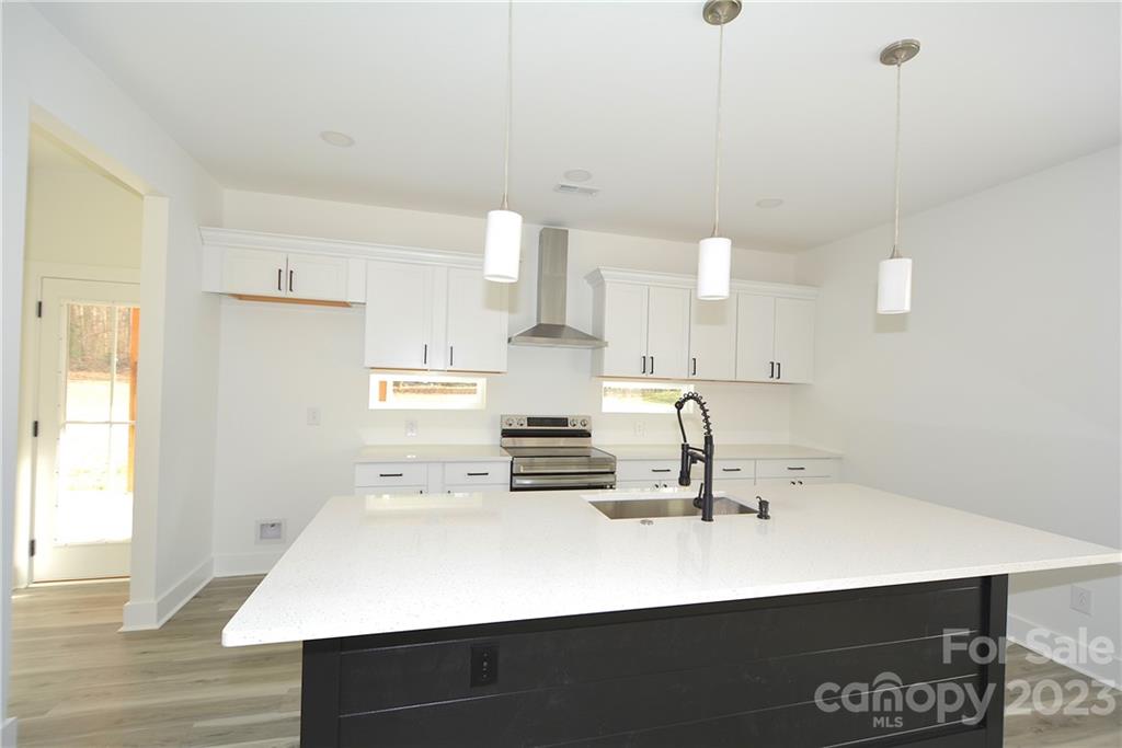 1511 Farm Road Shelby, NC 28152 - Photo 6 of 36 a kitchen with kitchen island a sink appliances and cabinets